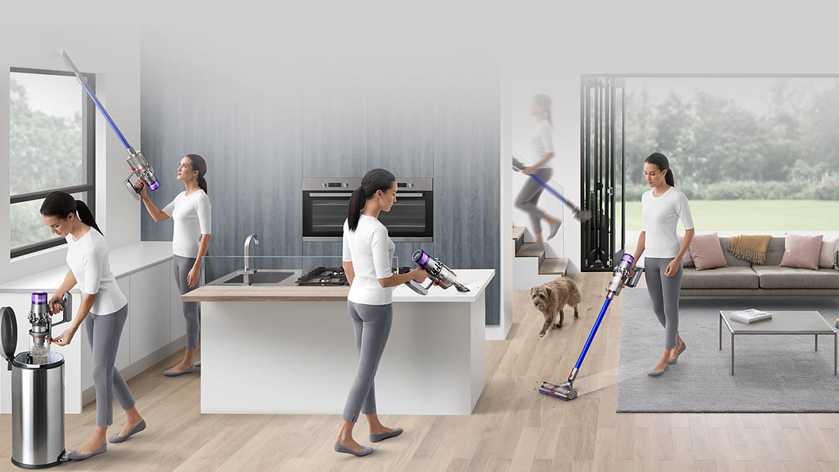 A demonstration of vacuuming above the head, on the floor, on the worktops, and up the stairs.